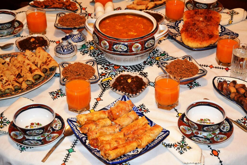 Traditional Moroccan Iftar food including Harira soup and dates
