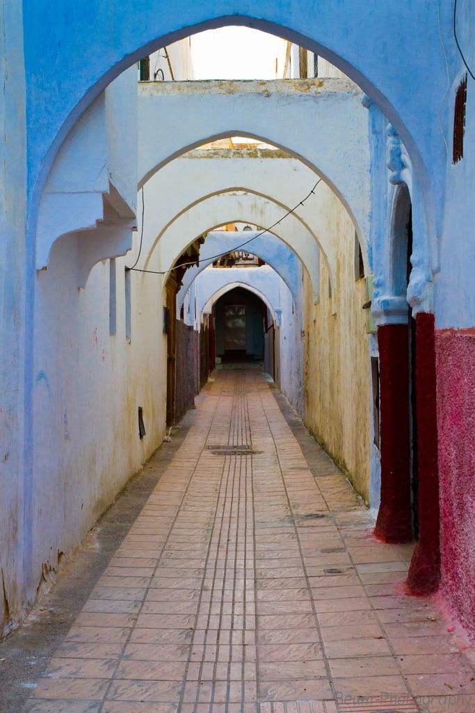 A narrow, blue-painted alleyway inside the historic Kasbah of the Udayas in Rabat