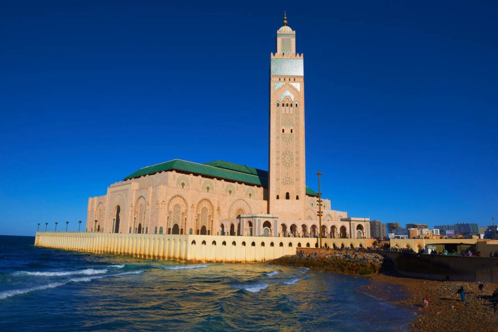 Hassan II Mosque at sunset with Atlantic Ocean