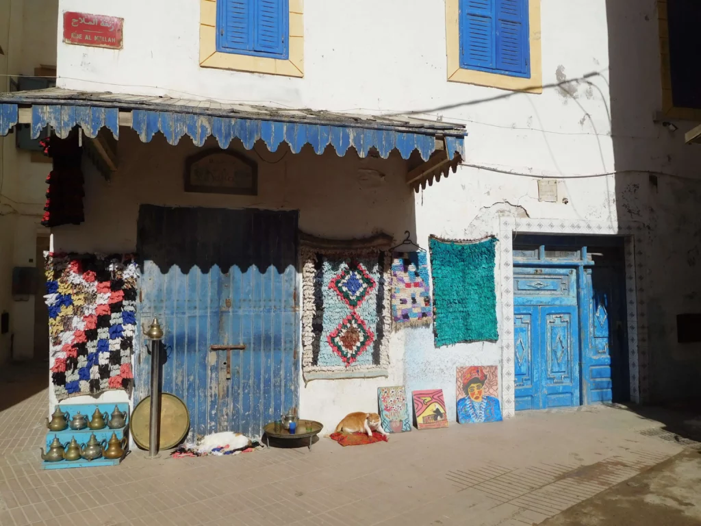 Blue and white medina streets of Essaouira with traditional doors in late spring