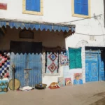 Blue and white medina streets of Essaouira with traditional doors in late spring
