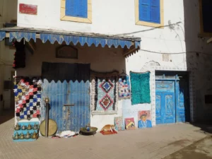 Blue and white medina streets of Essaouira with traditional doors in late spring